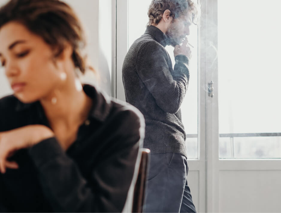 divorced couple backs to each other