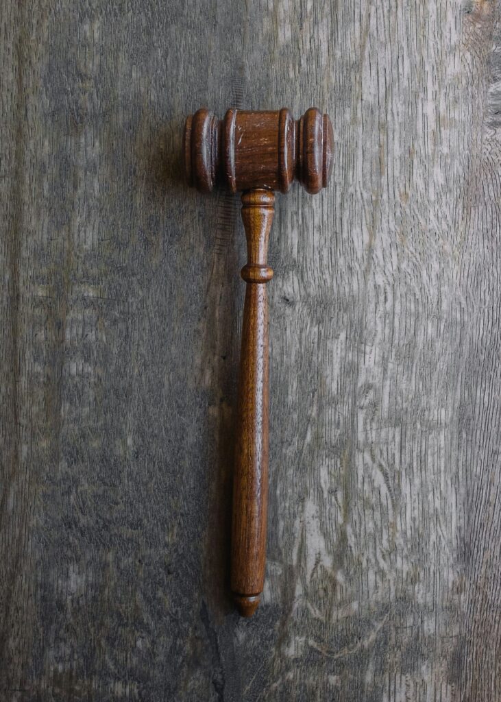Gavel in motion during a courtroom decision.